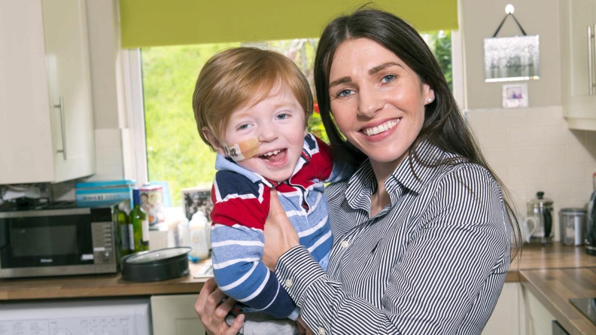 Irish mother and child smiling kitchen